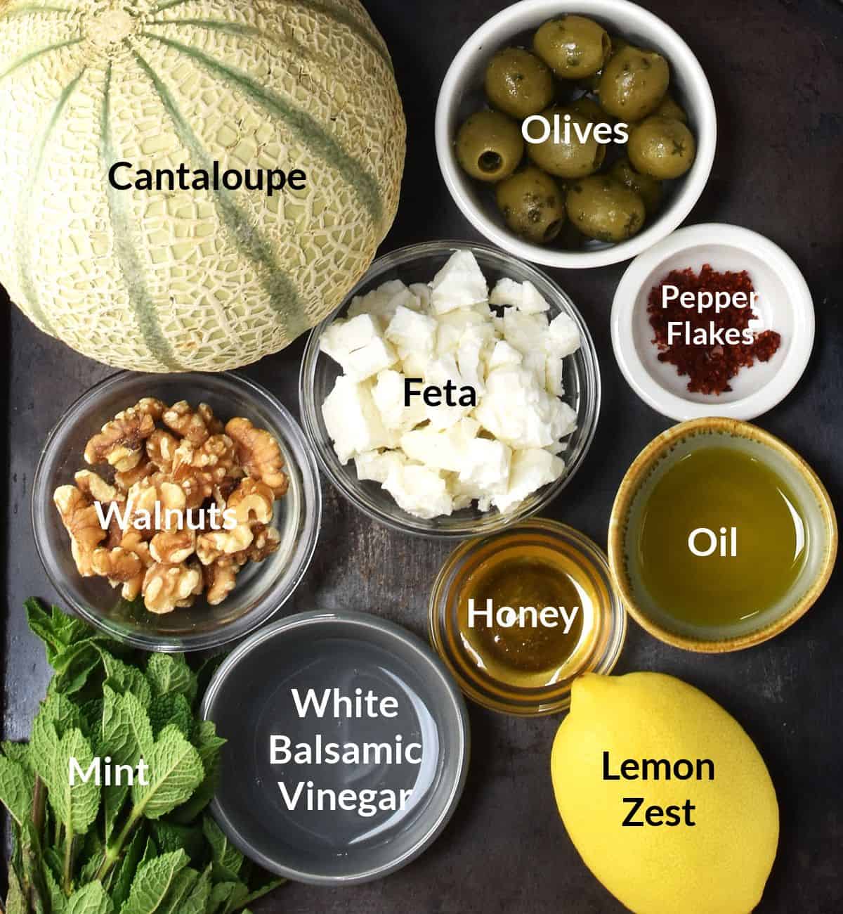 Ingredients for making cantaloupe melon salad in individual dishes.