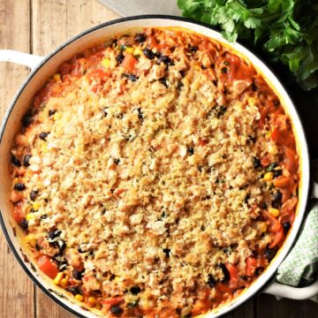Leftover turkey rice casserole with crispy bread topping in large shallow pan.
