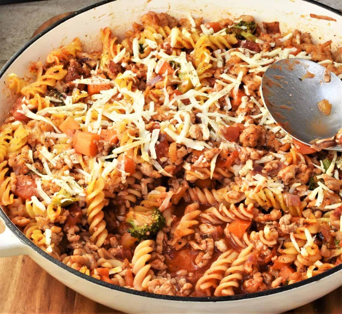 Partial top down view of ground chicken pasta bake in large diish