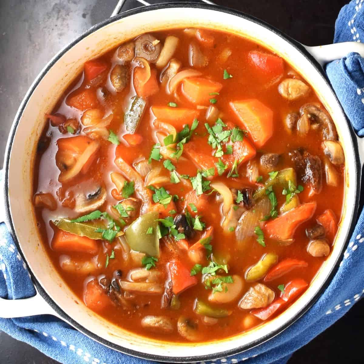 Top down view of vegetarian goulash in pot.